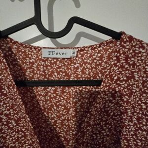 Rust colored with flowers wrap dress in Medium, true to size, never worn
